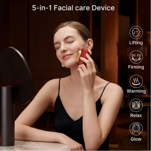 Woman using the GlassBeauty VibeSculptPro facial sculpting device along her jawline
